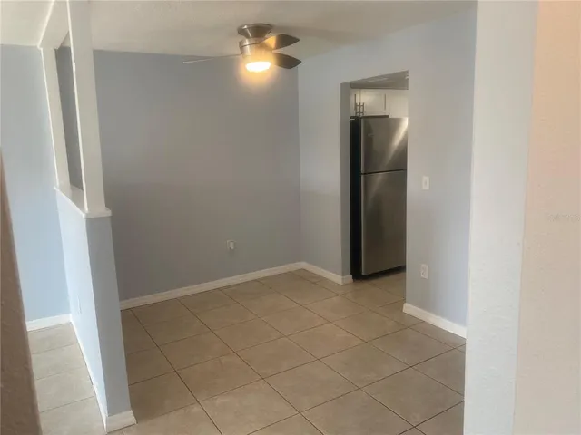 a view of an empty room with a mirror