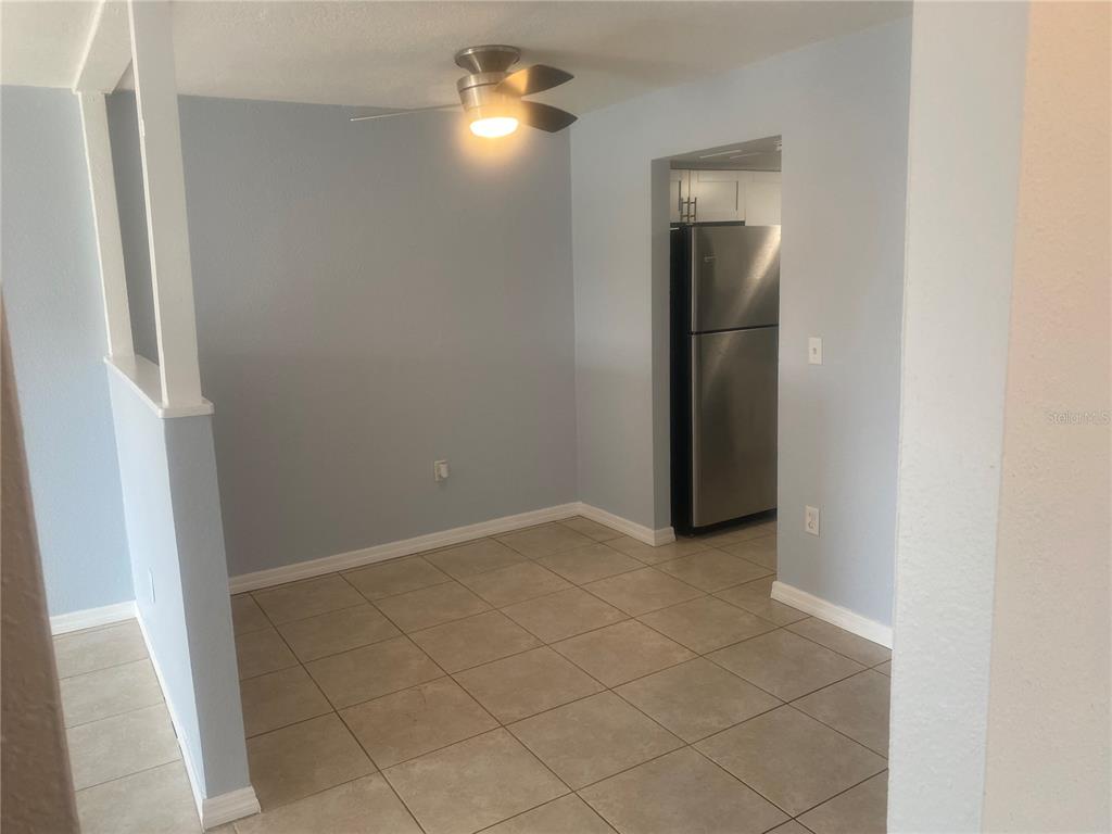 9925 Grace Drive Port Richey, FL 34668 - Photo 8 of 14 a view of an empty room with a mirror