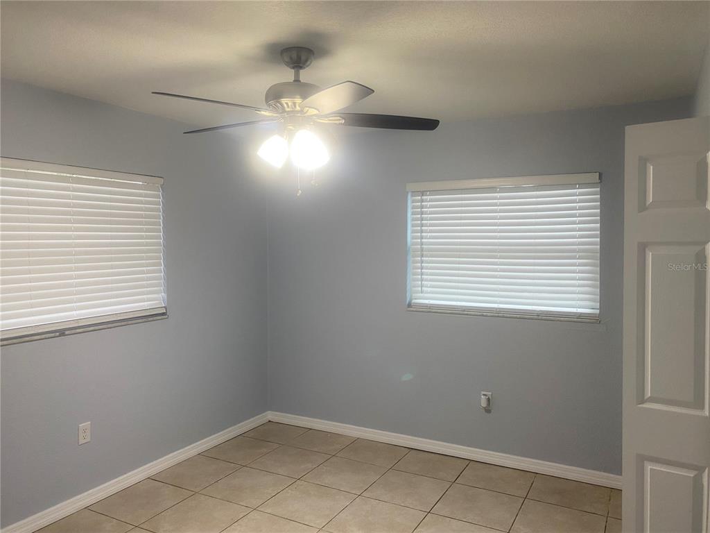 9925 Grace Drive Port Richey, FL 34668 - Photo 10 of 14 a view of an empty room with a window