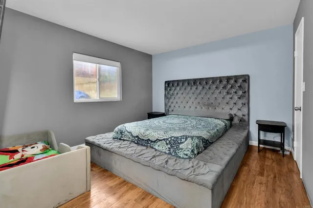 a bedroom with a bed and a fireplace