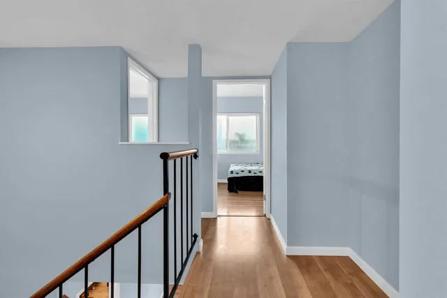 a view of a hallway with a room and a livingroom