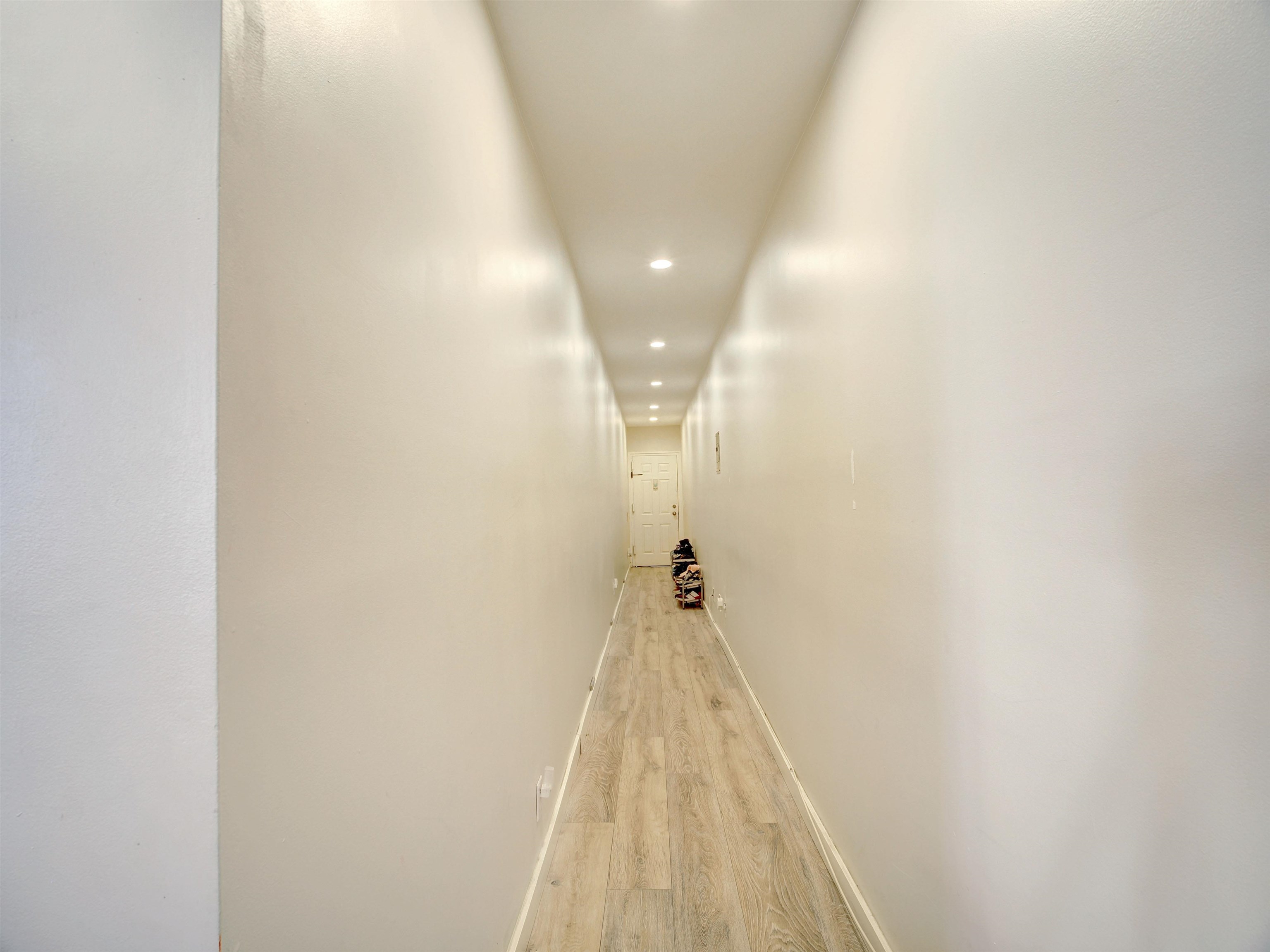 201 45th Street, Unit B4 Union City, NJ 07087 - Photo 4 of 8 a view of a hallway with a white door