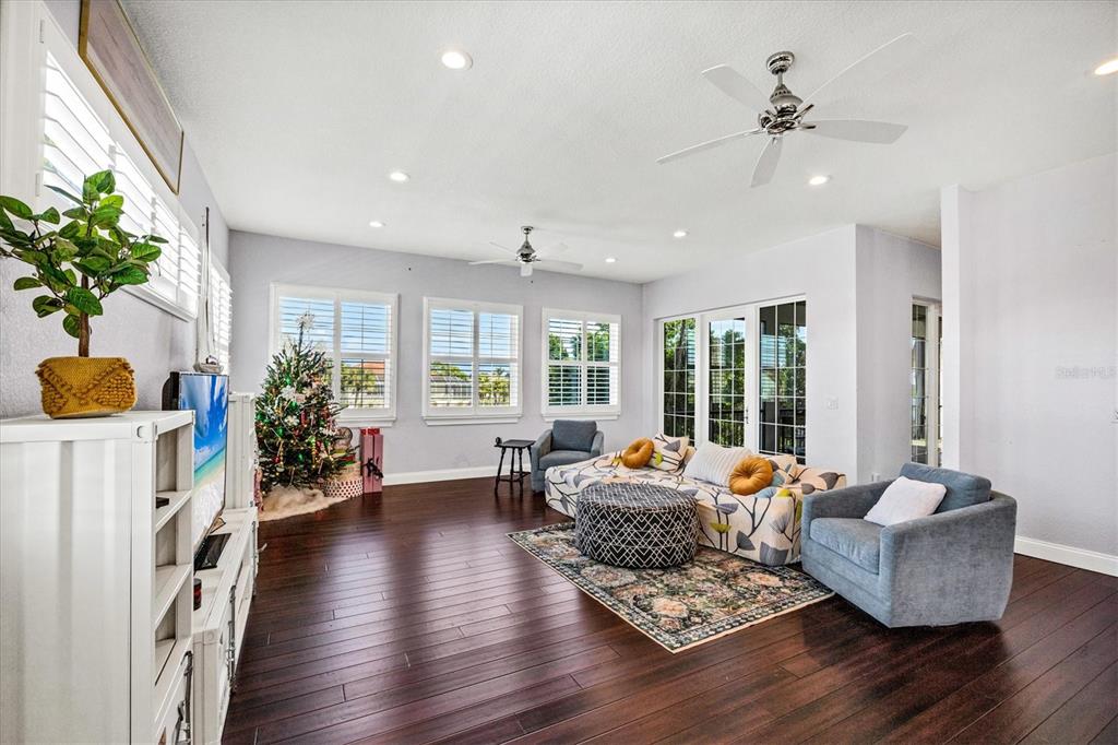 10050 Creekside Drive Placida, FL 33946 - Photo 17 of 52 a living room with furniture and a large window