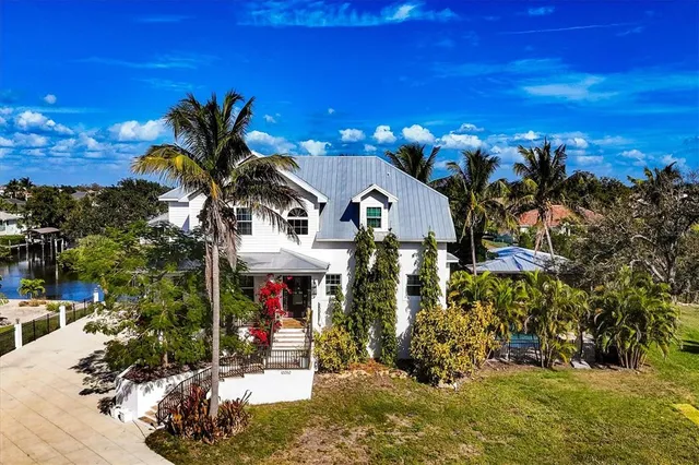 a view of a building with a tree in front