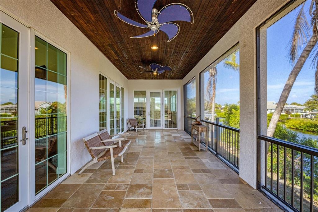 10050 Creekside Drive Placida, FL 33946 - Photo 21 of 52 a view of a porch with furniture