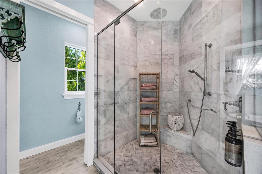 10050 Creekside Drive Placida, FL 33946 - Photo 27 of 52 a bathroom with a shower