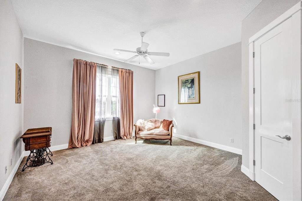 10050 Creekside Drive Placida, FL 33946 - Photo 33 of 52 a bedroom with a bed and a chandelier