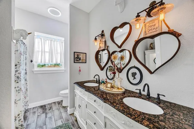 a dining room with furniture and wooden floor