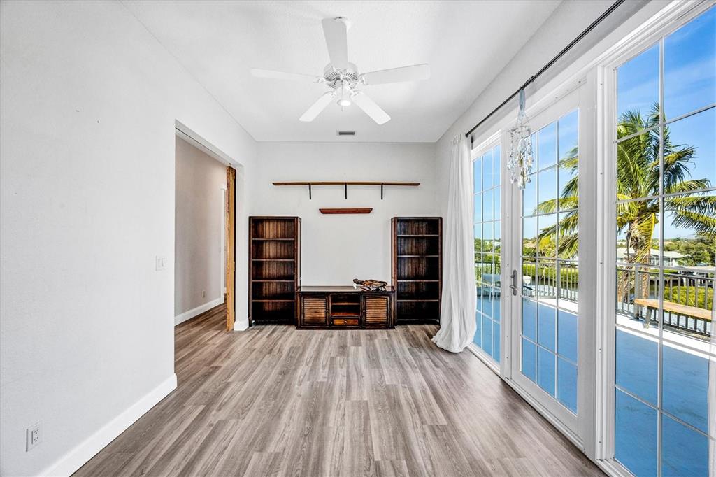 10050 Creekside Drive Placida, FL 33946 - Photo 35 of 52 a dining room with furniture and wooden floor