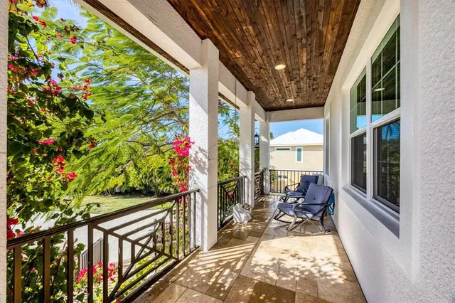 a view of balcony with furniture