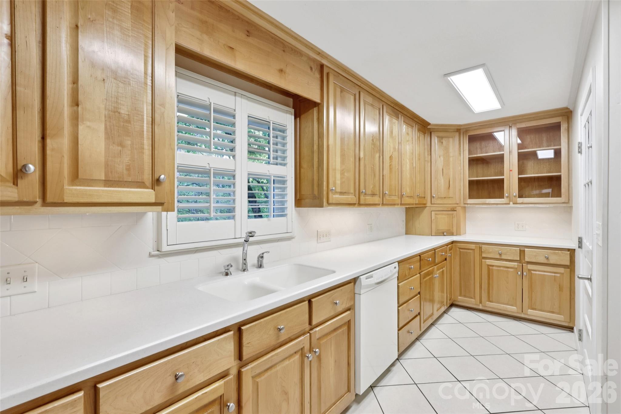 1002 Ridge Street Albemarle, NC 28001 - Photo 17 of 45 a kitchen with granite countertop sink and cabinets
