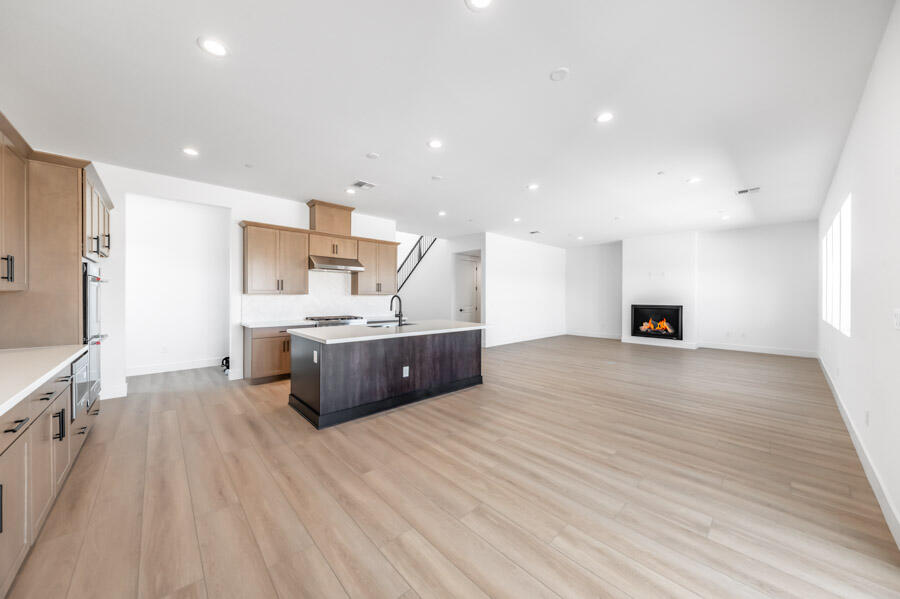 401 Pah Rah Rdg Drive, Unit MAGNOLIA 35 Sparks, NV 89441 - Photo 13 of 21 a large white kitchen with a sink and cabinets