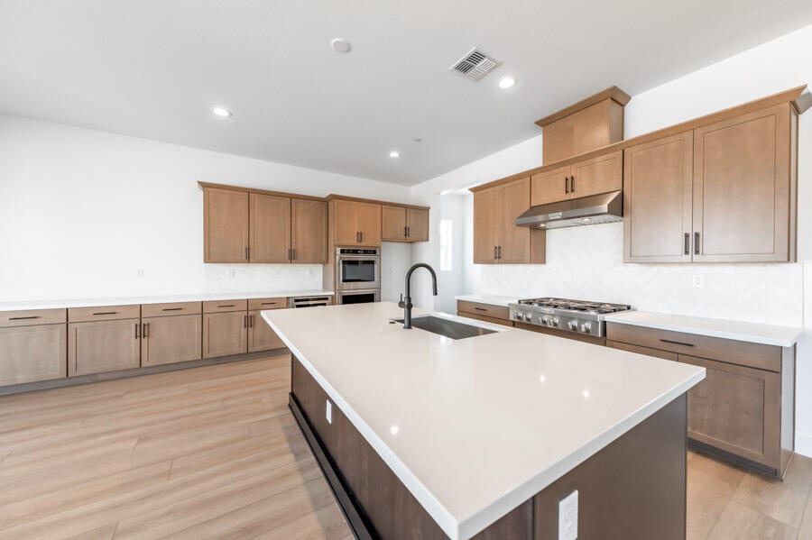 401 Pah Rah Rdg Drive, Unit MAGNOLIA 35 Sparks, NV 89441 - Photo 8 of 21 a kitchen with stainless steel appliances a sink and a stove top oven