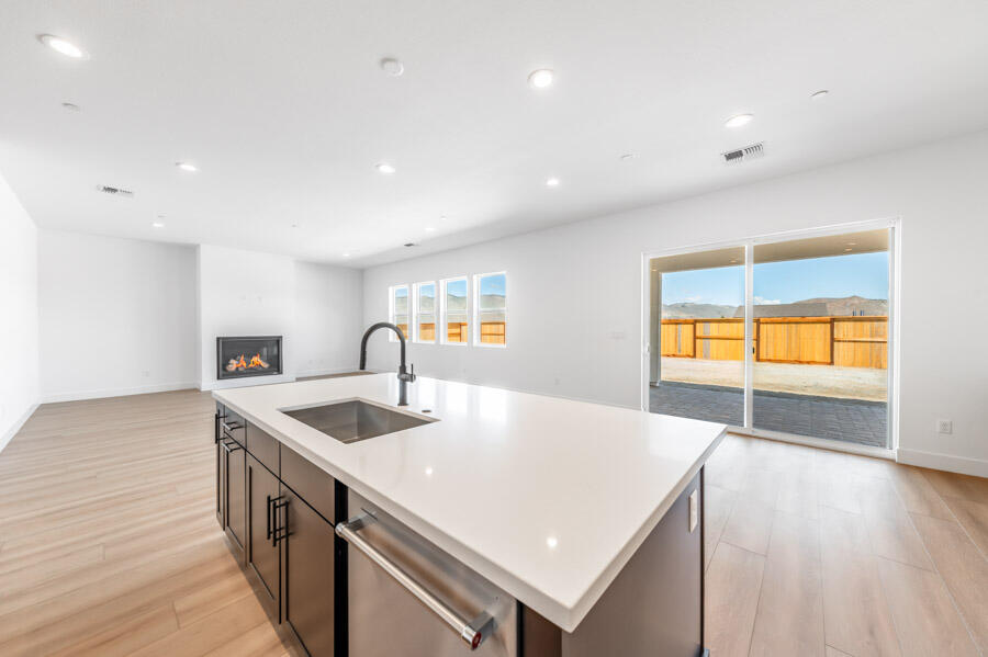 401 Pah Rah Rdg Drive, Unit MAGNOLIA 35 Sparks, NV 89441 - Photo 10 of 21 a kitchen with kitchen island a sink appliances and wooden floor