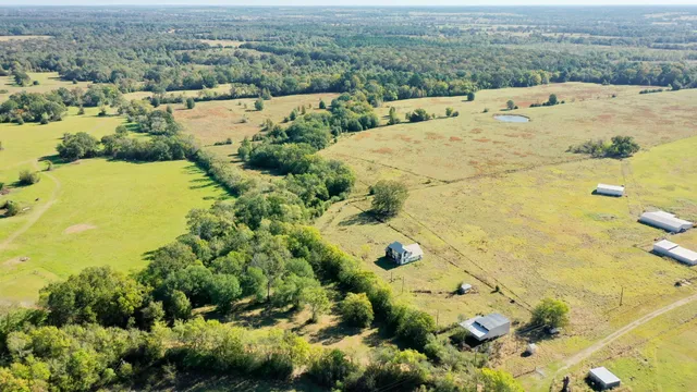 an aerial view of residential houses with outdoor space