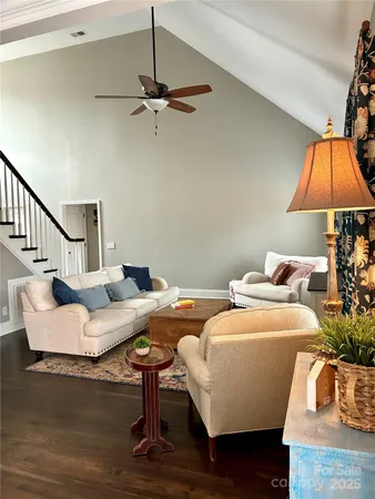 a living room with furniture and a lamp