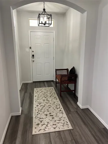 a view of room with wooden floor