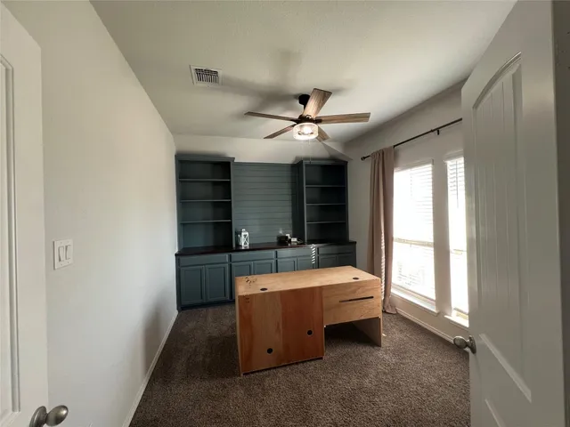 a room with bed and window