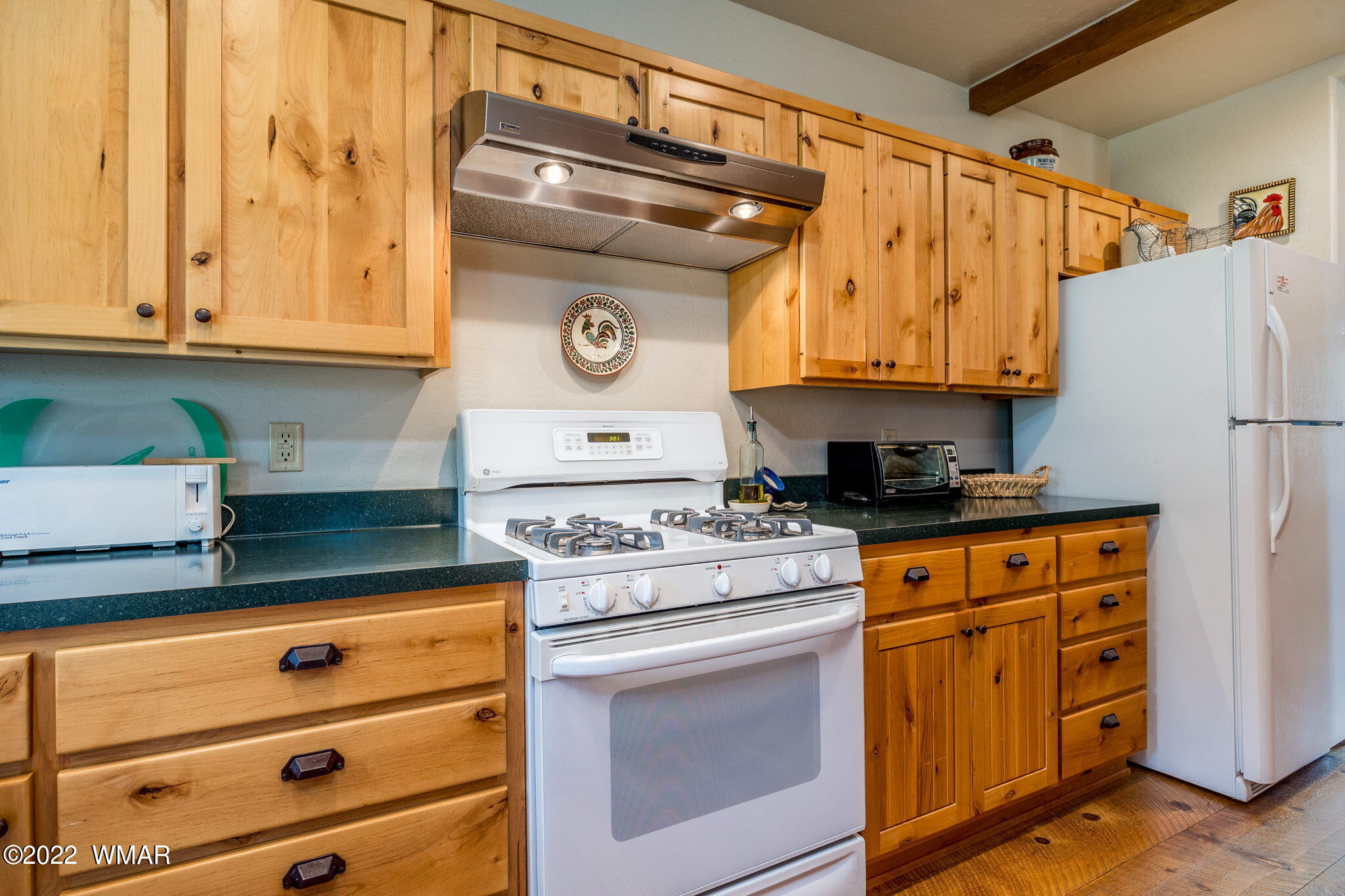 11 N1063 Greer, AZ 85927 - Photo 15 of 31 a kitchen with stainless steel appliances granite countertop a refrigerator and a stove