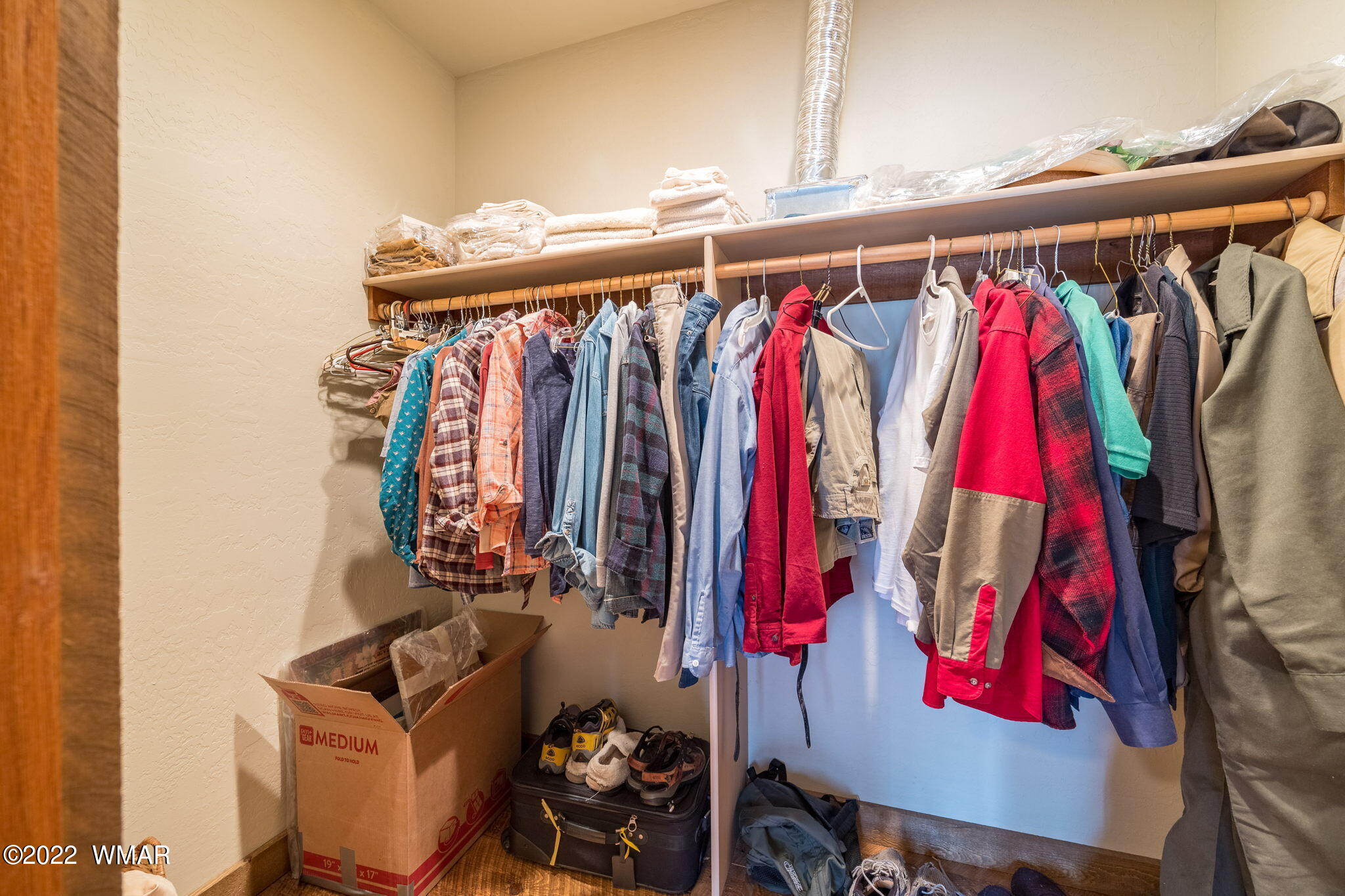 11 N1063 Greer, AZ 85927 - Photo 20 of 31 a view of walk in closet with clothes and shoes