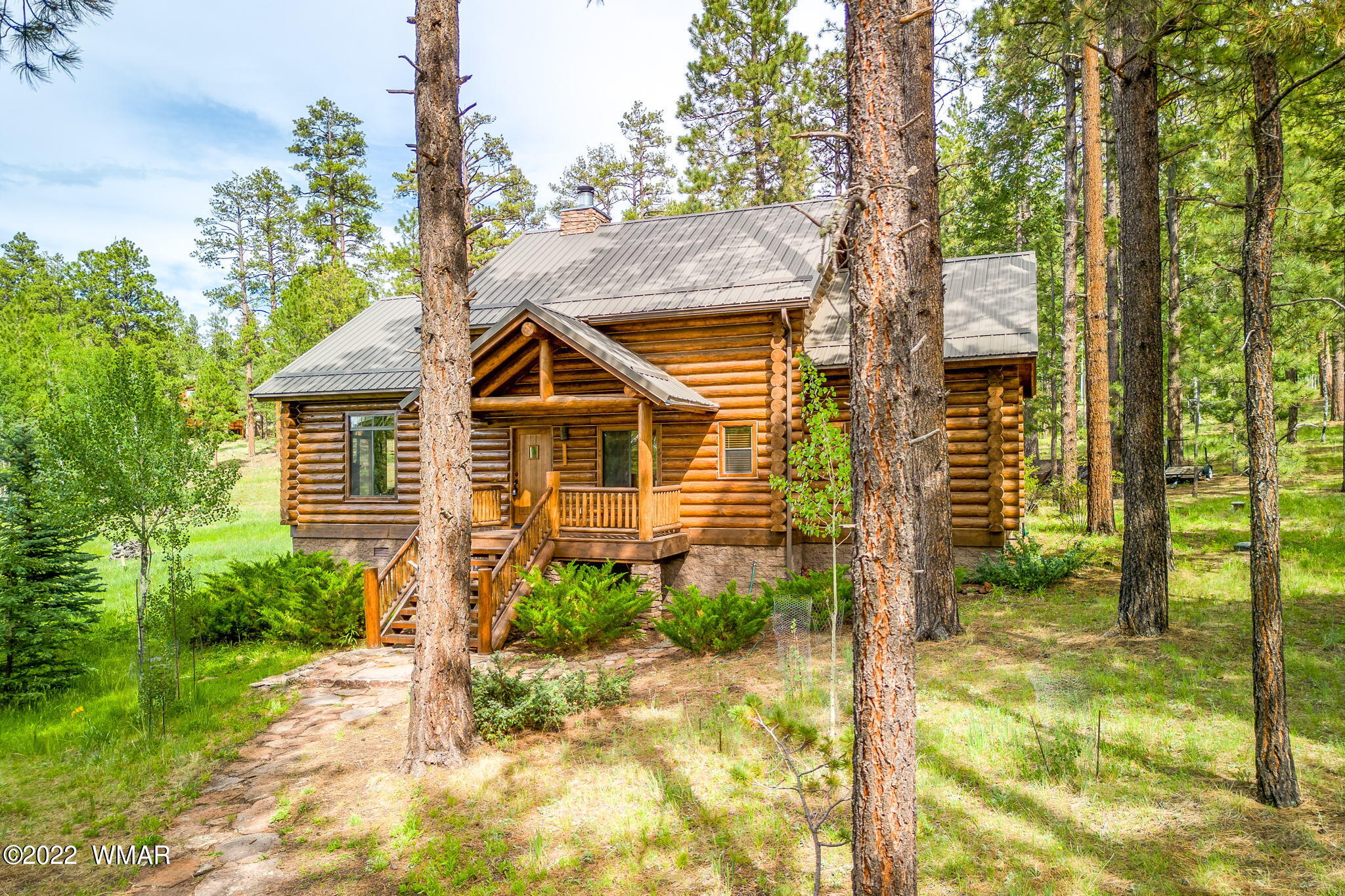 11 N1063 Greer, AZ 85927 - Photo 2 of 31 a front view of a house with a yard