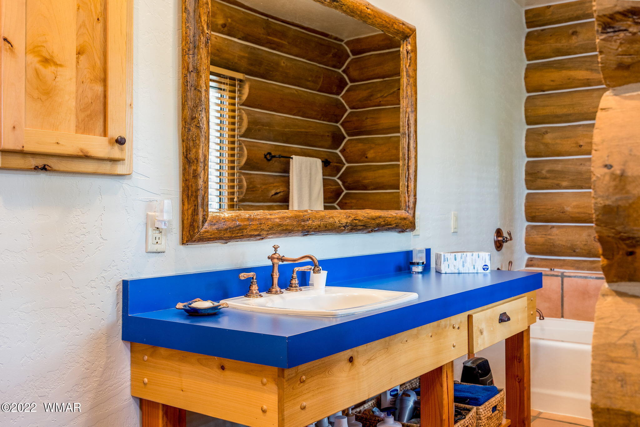 11 N1063 Greer, AZ 85927 - Photo 22 of 31 a bathroom with a sink and a mirror