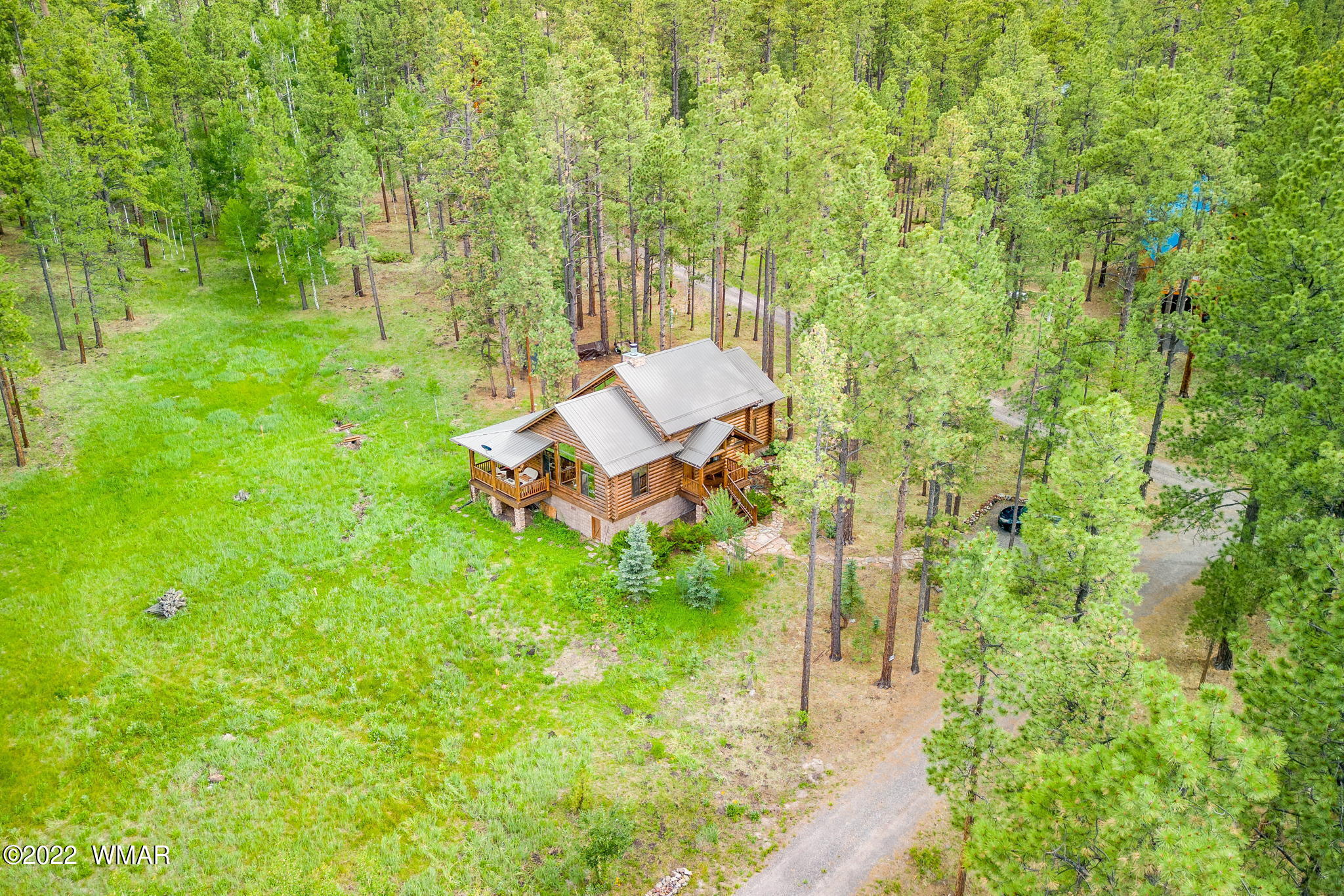 11 N1063 Greer, AZ 85927 - Photo 5 of 31 a view of a backyard with plants and a garden
