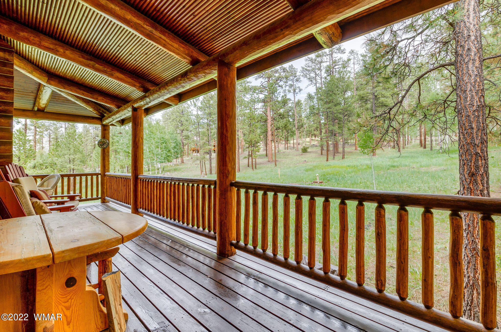 11 N1063 Greer, AZ 85927 - Photo 6 of 31 a view of balcony with wooden floor and outdoor seating