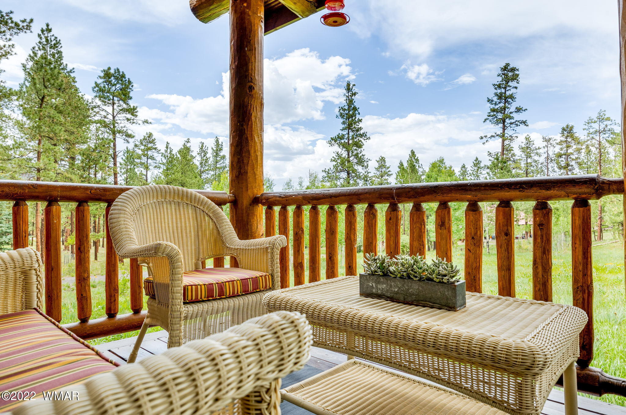 11 N1063 Greer, AZ 85927 - Photo 9 of 31 a balcony view with couple of chairs and wooden floor