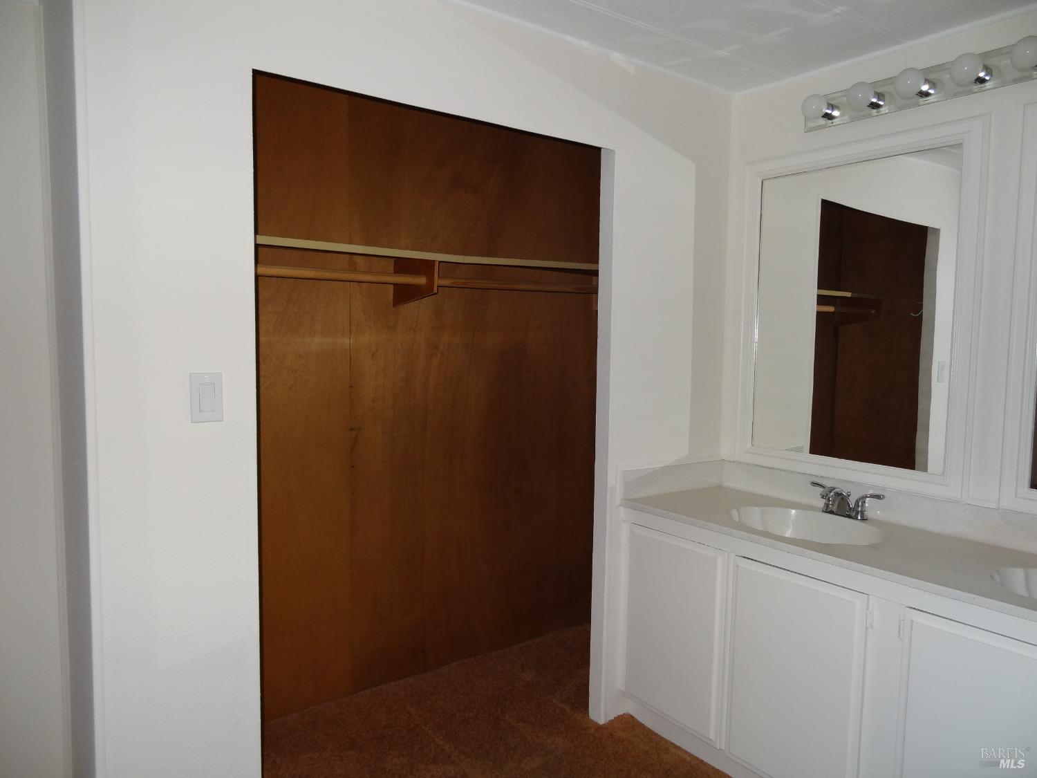 6 Larkspur Place Santa Rosa, CA 95409 - Photo 2 of 7 a bathroom with a sink and a mirror