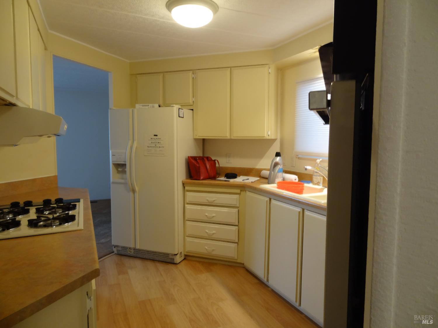 6 Larkspur Place Santa Rosa, CA 95409 - Photo 3 of 7 a kitchen with a refrigerator and a stove