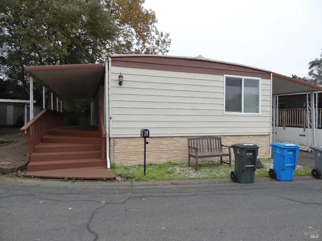 a front view of a house with garage
