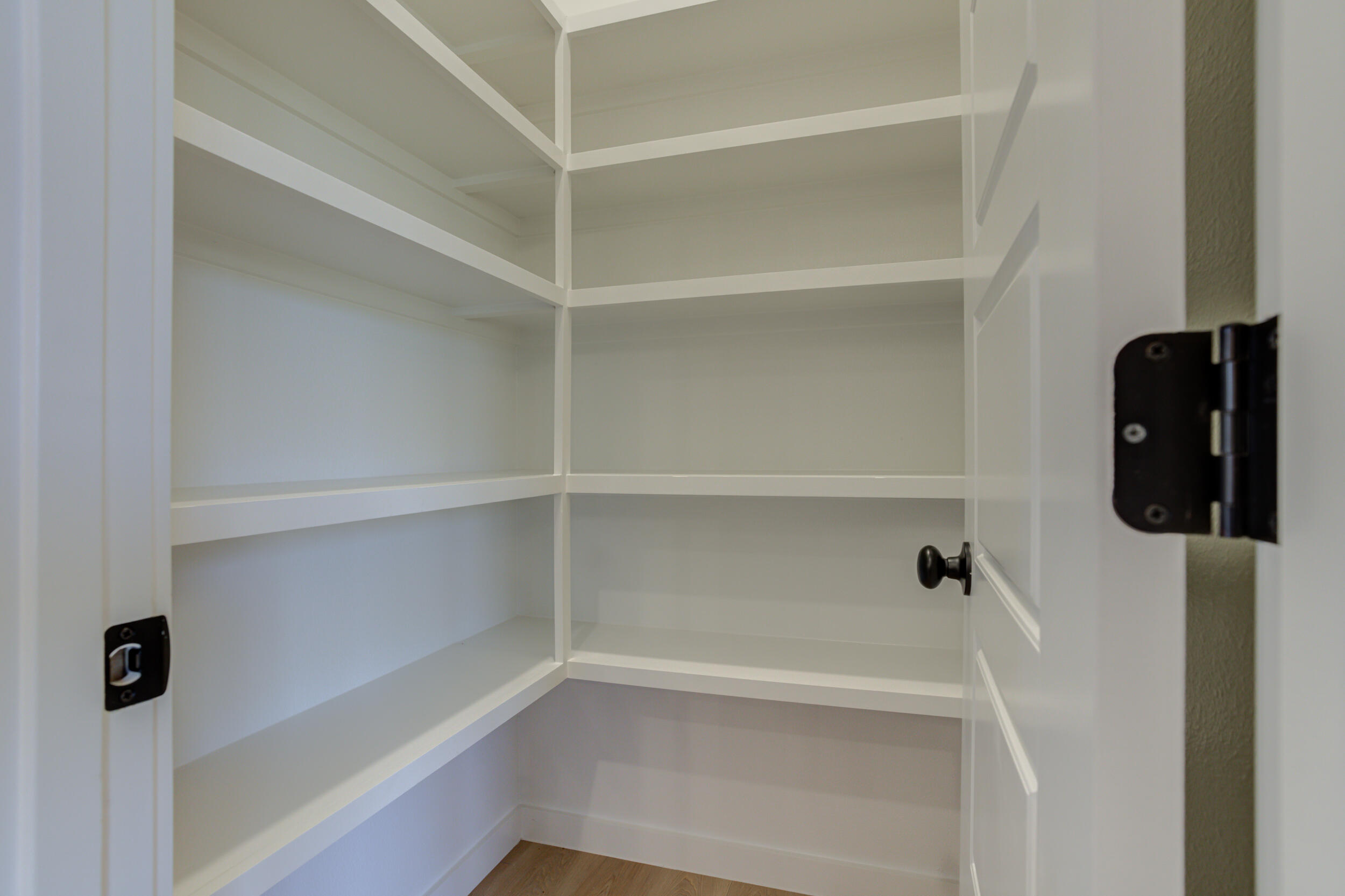 6913 13th Street Lubbock, TX 79416 - Photo 22 of 45 a view of walk in closet with empty racks
