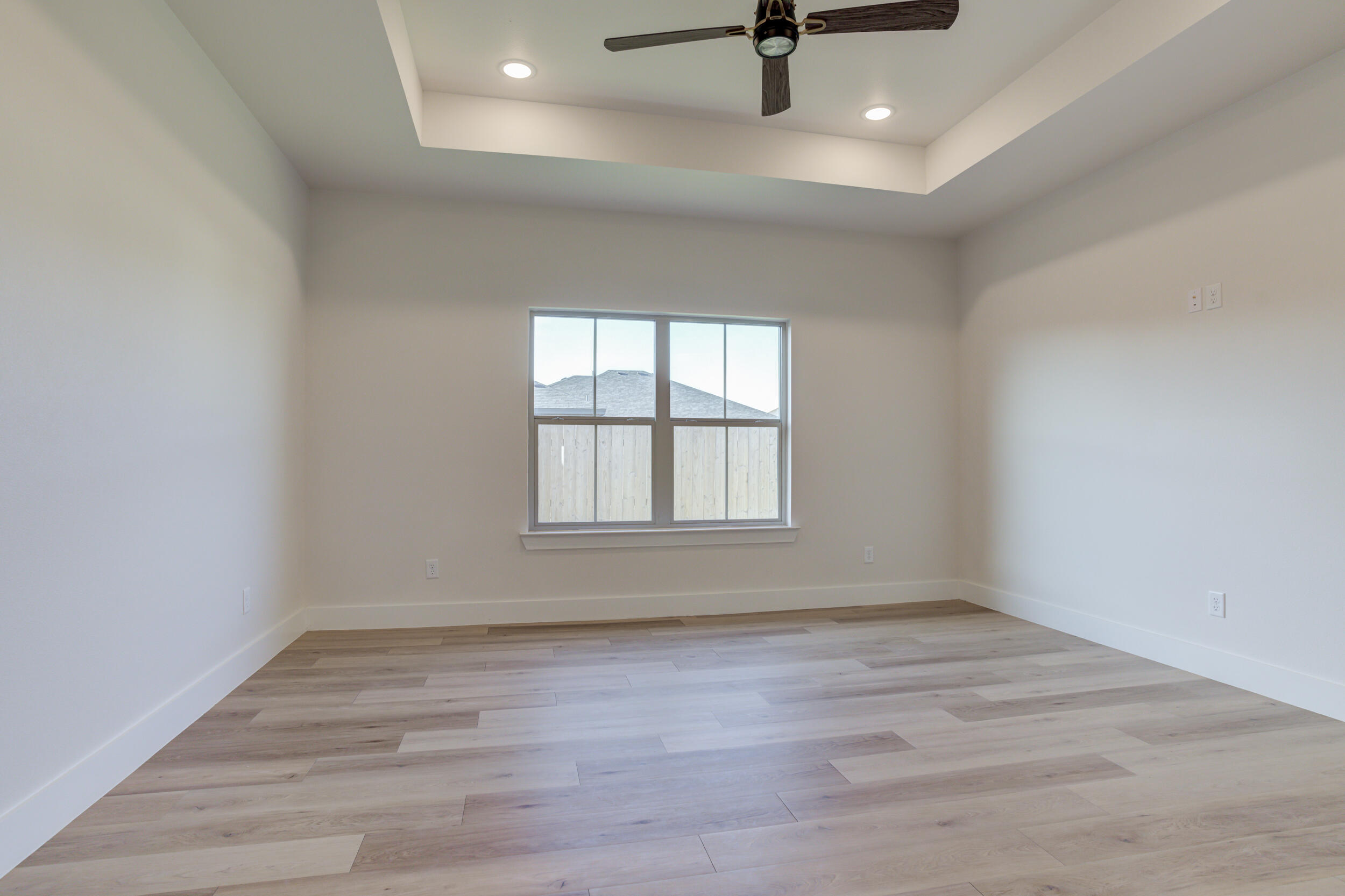 6913 13th Street Lubbock, TX 79416 - Photo 26 of 45 wooden floor in an empty room with a window