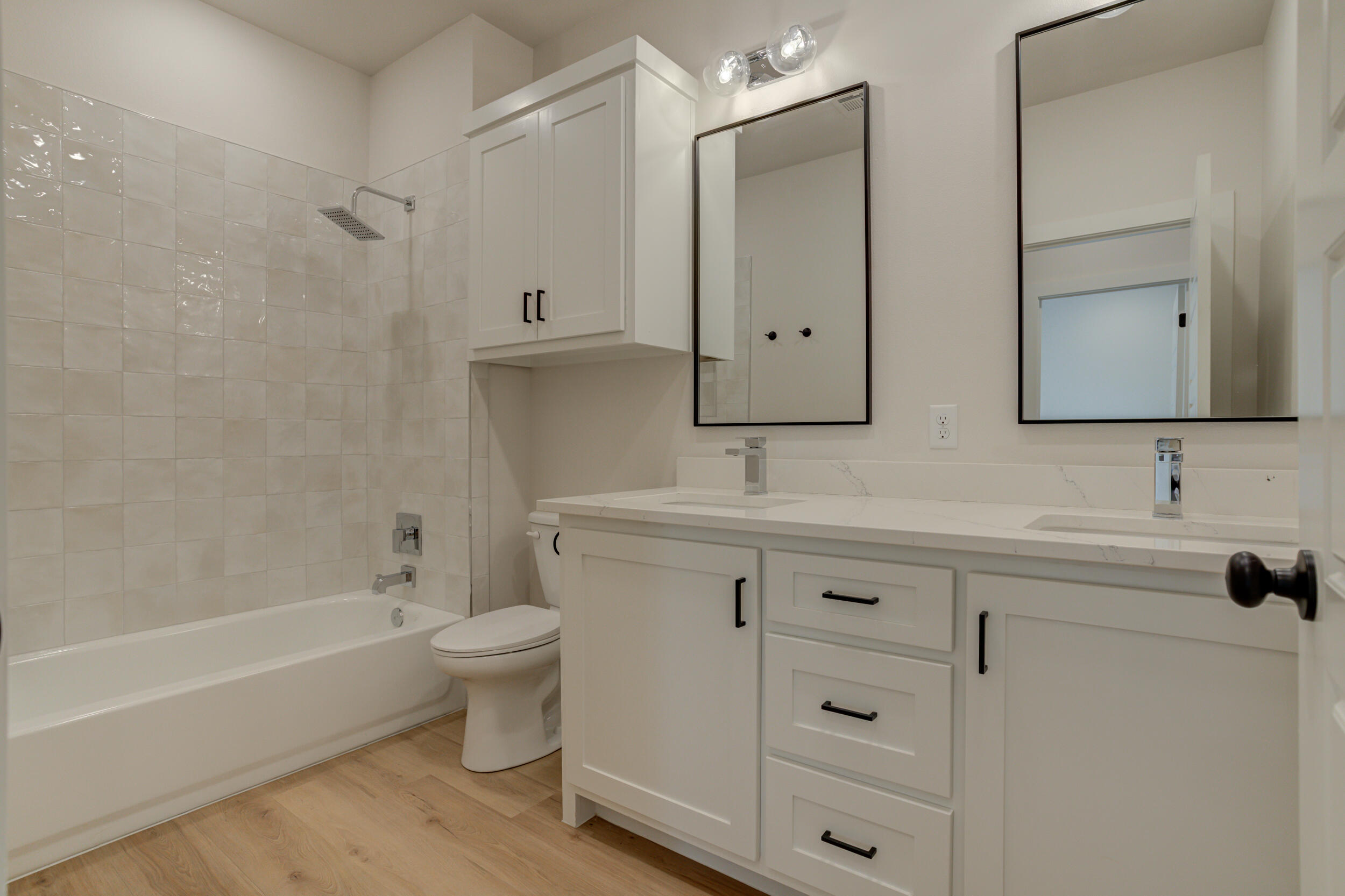 6913 13th Street Lubbock, TX 79416 - Photo 37 of 45 a bathroom with a double vanity sink mirror and toilet