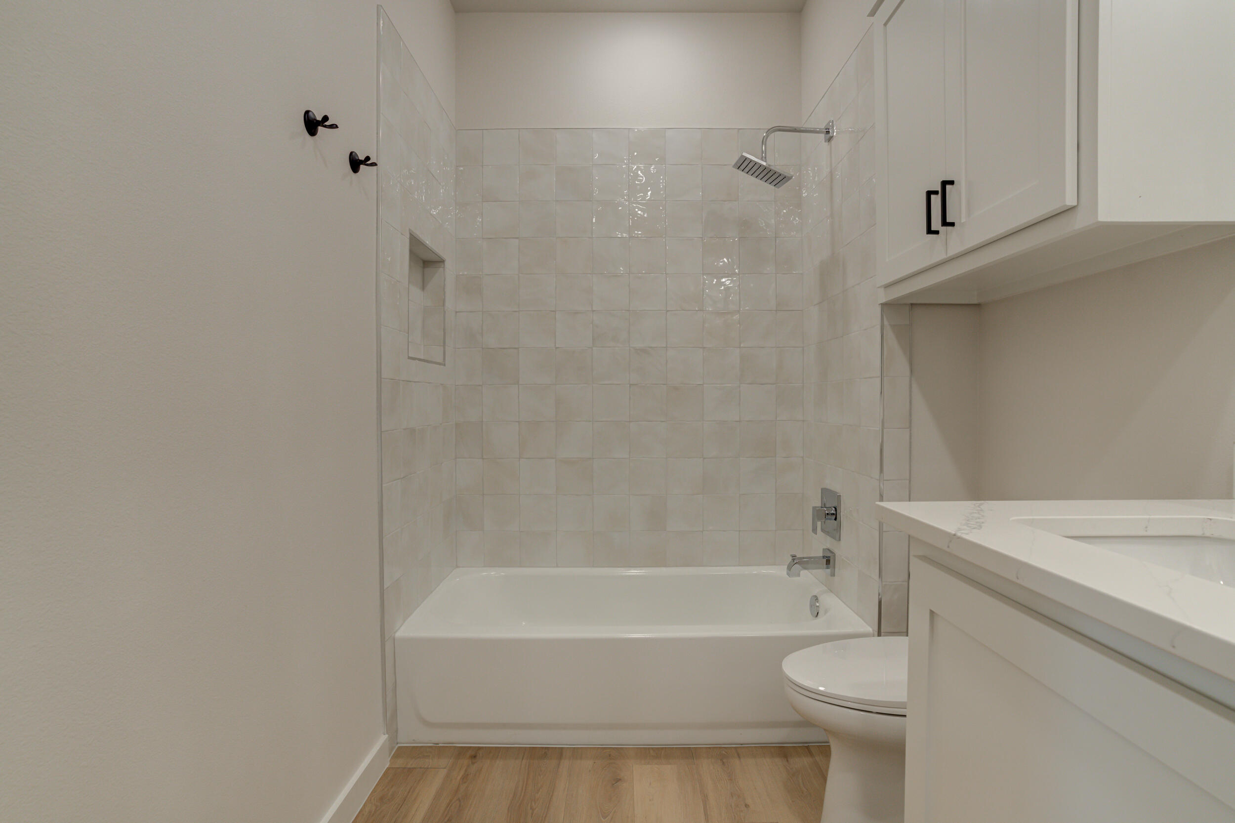 6913 13th Street Lubbock, TX 79416 - Photo 38 of 45 a bathroom with a bathtub and a toilet