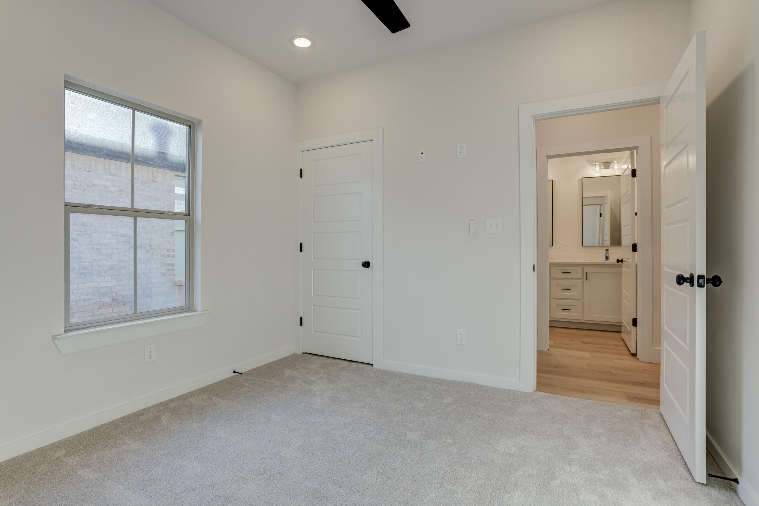6913 13th Street Lubbock, TX 79416 - Photo 39 of 45 an empty room with windows and closet