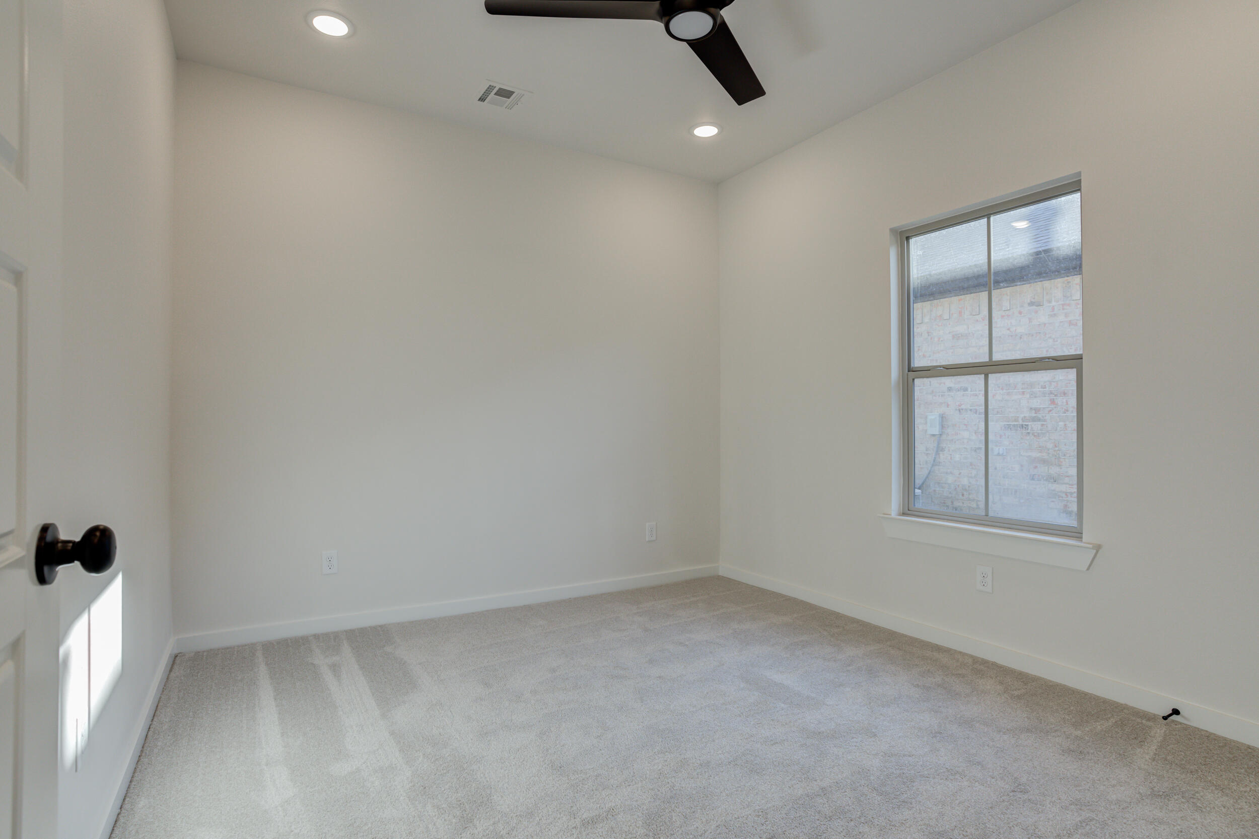 6913 13th Street Lubbock, TX 79416 - Photo 40 of 45 an empty room with a window