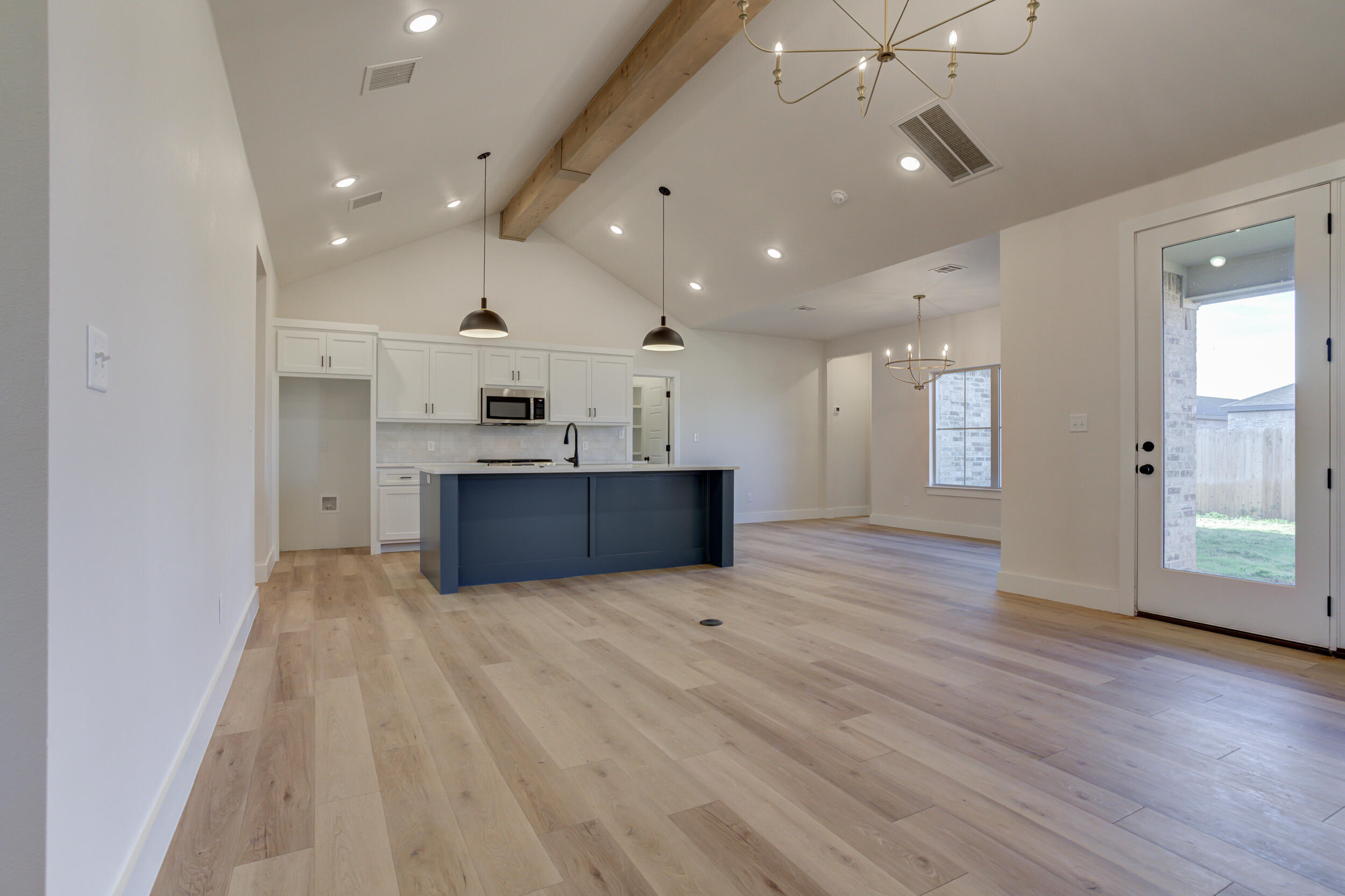 6913 13th Street Lubbock, TX 79416 - Photo 6 of 45 a view of kitchen and kitchen with hardwood floor