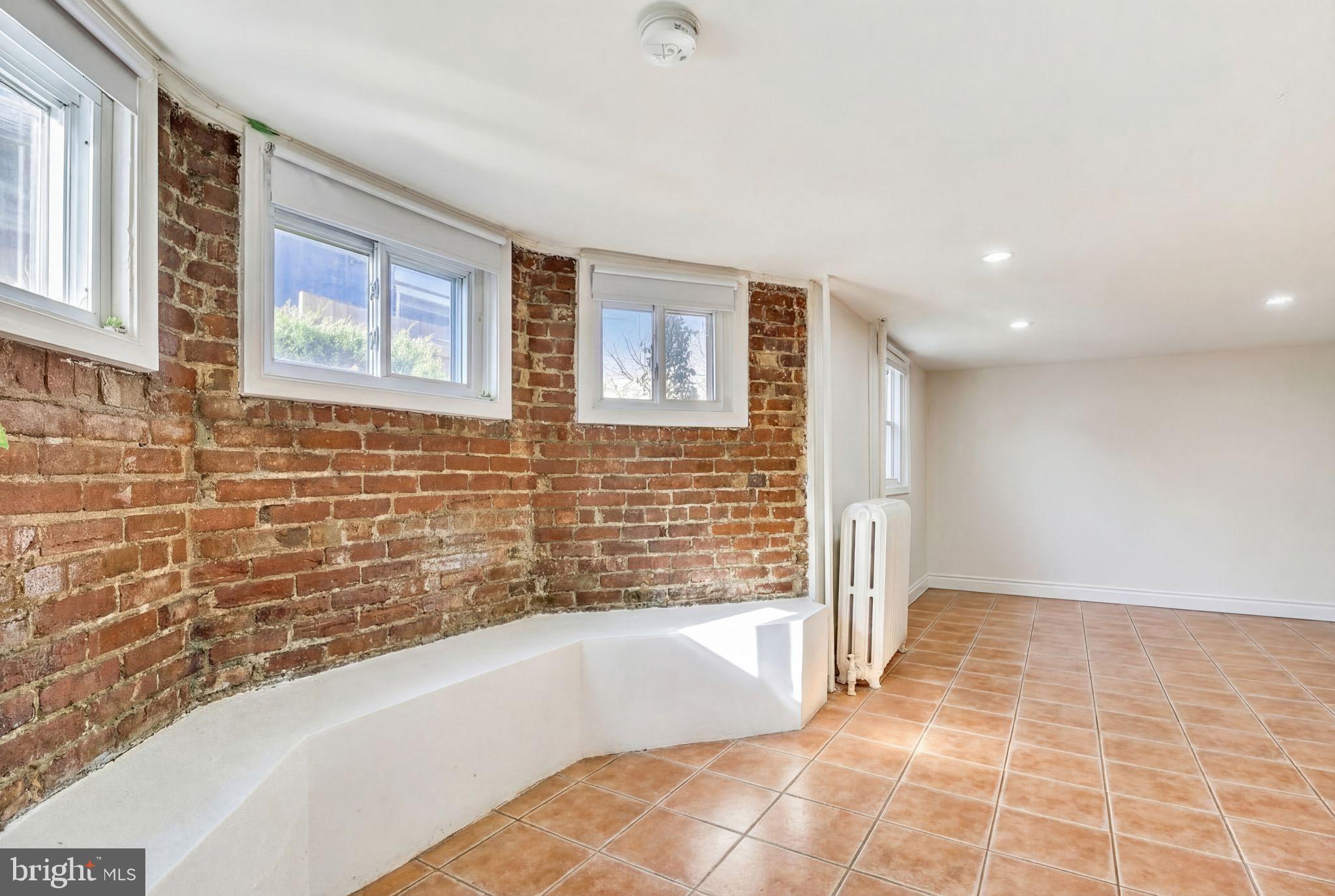 746 Thayer Avenue Silver Spring, MD 20910 - Photo 29 of 43 a bathroom with a bathtub and a shower