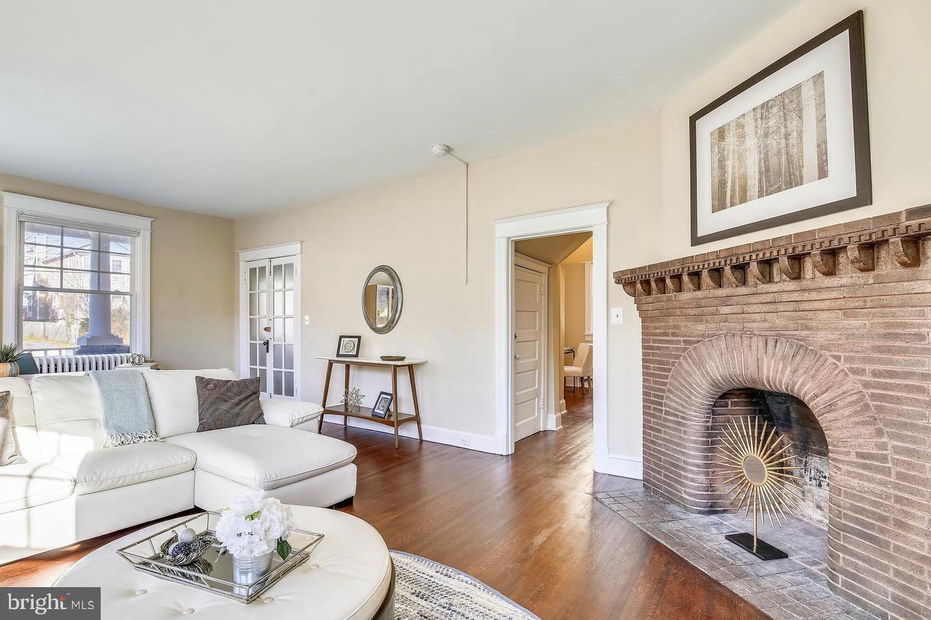 746 Thayer Avenue Silver Spring, MD 20910 - Photo 6 of 43 a living room with furniture and a fireplace