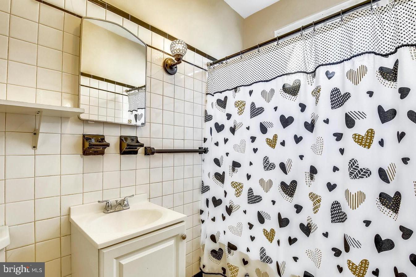 746 Thayer Avenue Silver Spring, MD 20910 - Photo 10 of 43 a bathroom with a sink and a shower