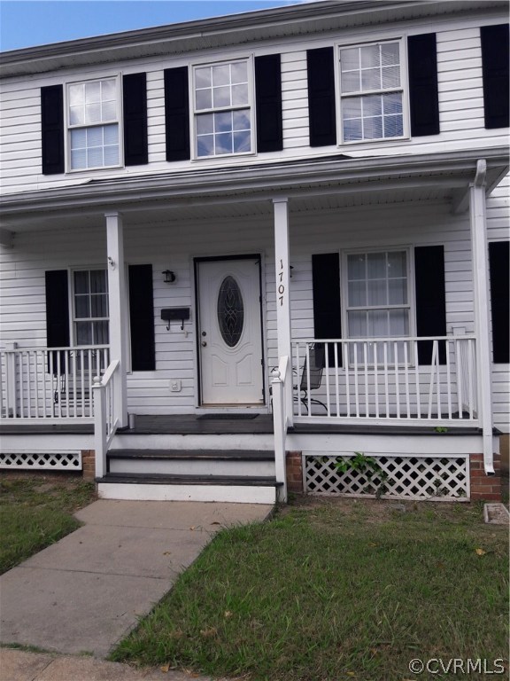 1707 Decatur Street Richmond, VA 23224 - Photo 1 of 8 a view of a house with a small yard and wooden floor and fence
