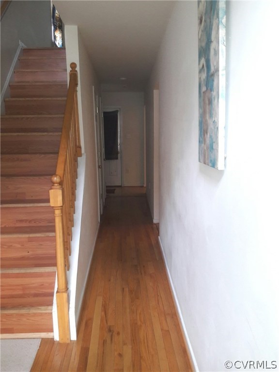1707 Decatur Street Richmond, VA 23224 - Photo 4 of 8 a view of a hallway with wooden floor and staircase