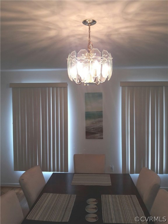 1707 Decatur Street Richmond, VA 23224 - Photo 5 of 8 a view of a livingroom with furniture wooden floor and a chandelier