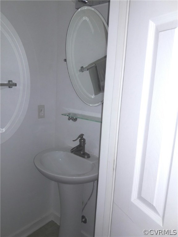 1707 Decatur Street Richmond, VA 23224 - Photo 6 of 8 a bathroom with a sink and mirror