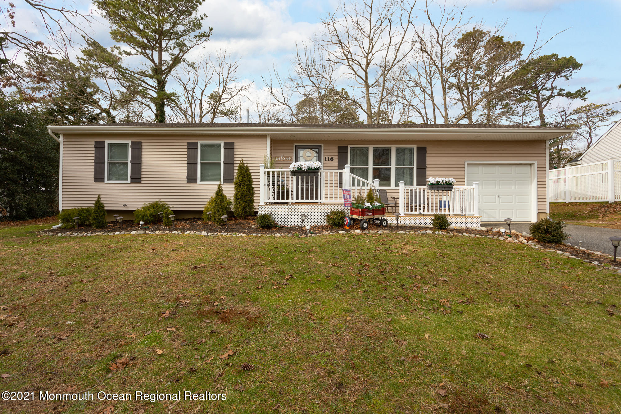 116 Toggle Road Manahawkin, NJ 08050 - Photo 1 of 26 a front view of a house with garden