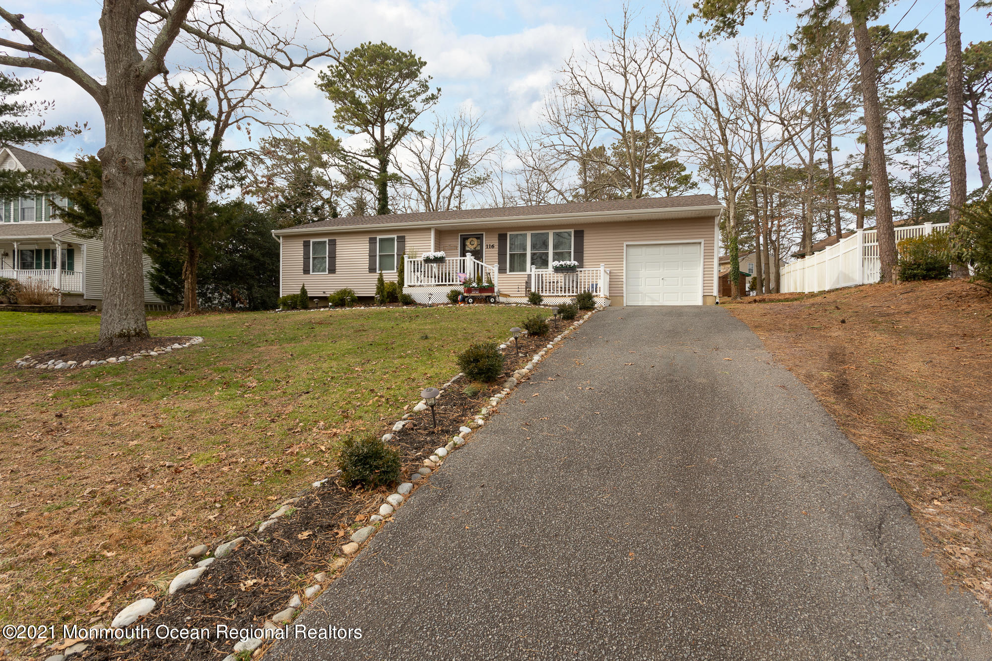 116 Toggle Road Manahawkin, NJ 08050 - Photo 2 of 26 a front view of a house with a yard and trees