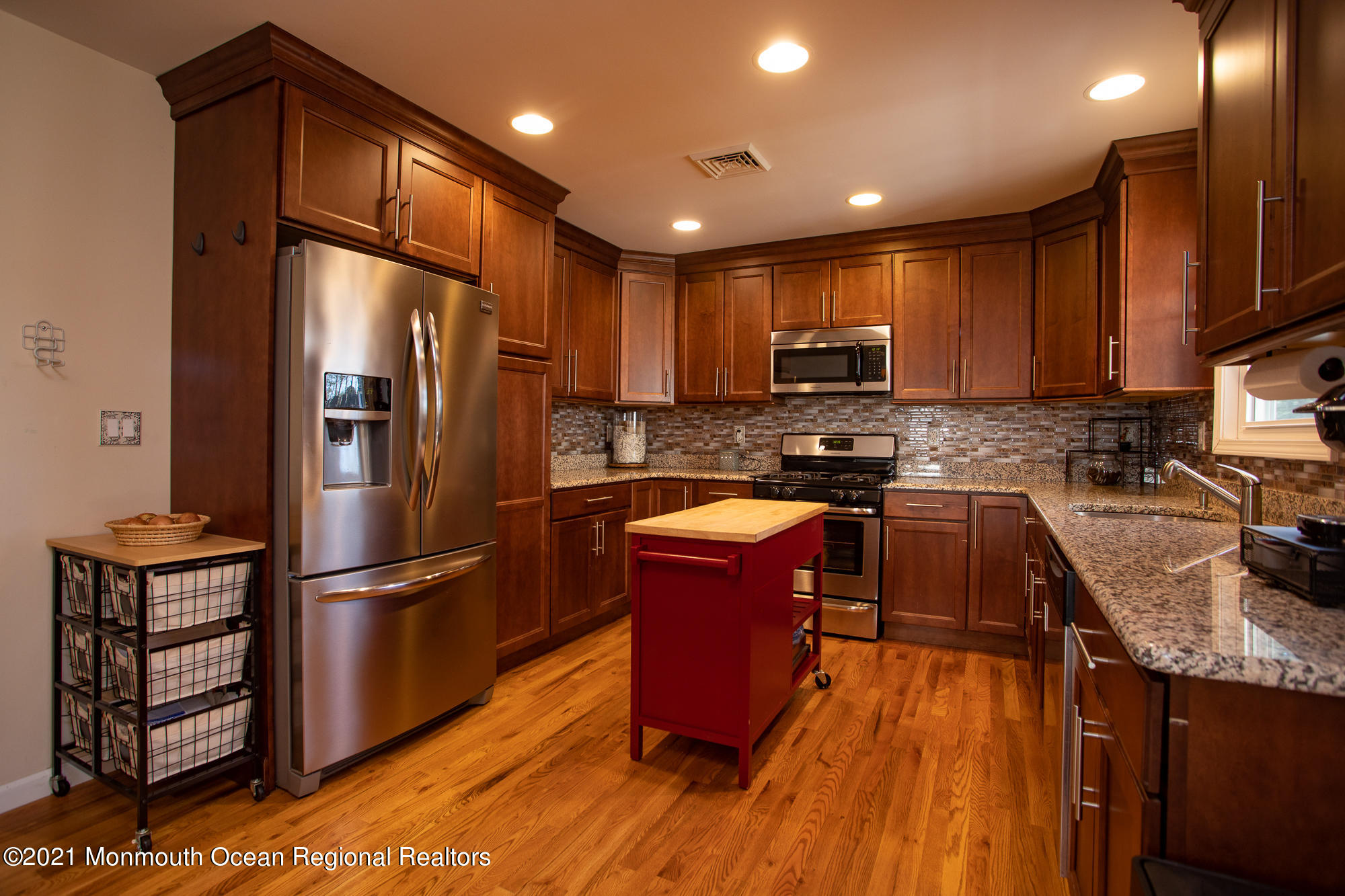 116 Toggle Road Manahawkin, NJ 08050 - Photo 11 of 26 a kitchen with stainless steel appliances granite countertop a refrigerator a stove top oven a sink and dishwasher