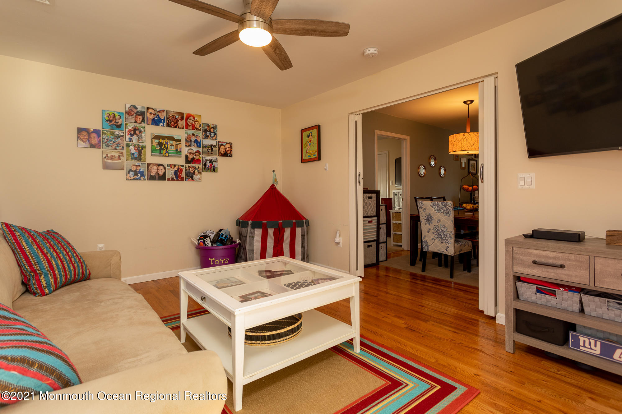 116 Toggle Road Manahawkin, NJ 08050 - Photo 13 of 26 a living room with furniture and a flat screen tv